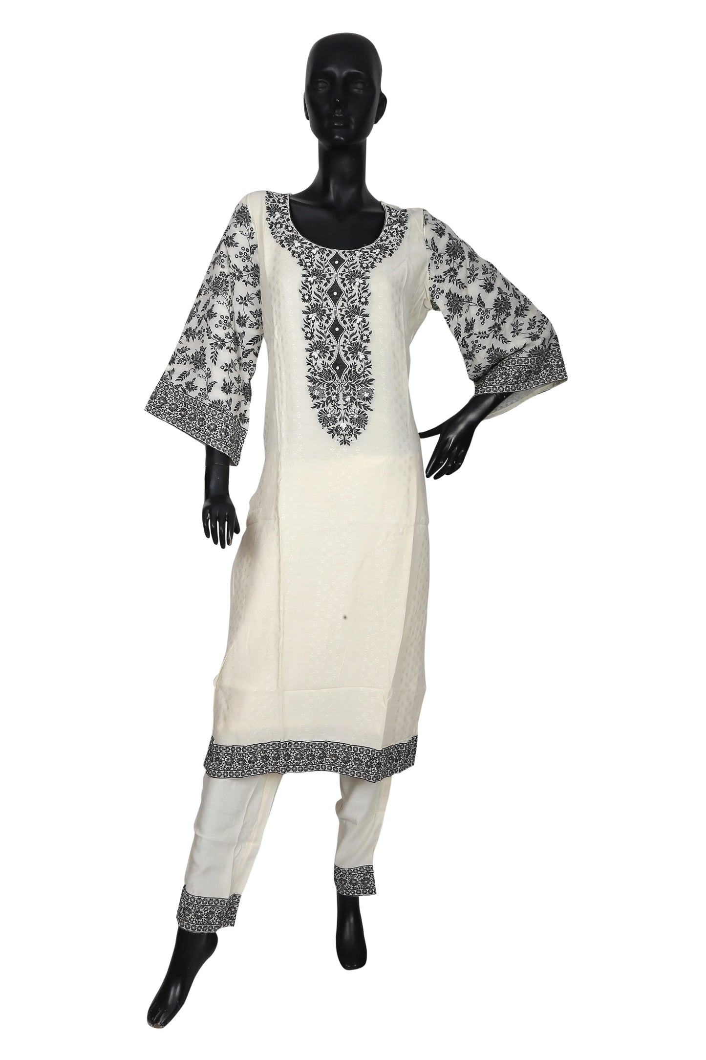 White kurta pajama with black floral embroidery on mannequin, traditional ethnic wear