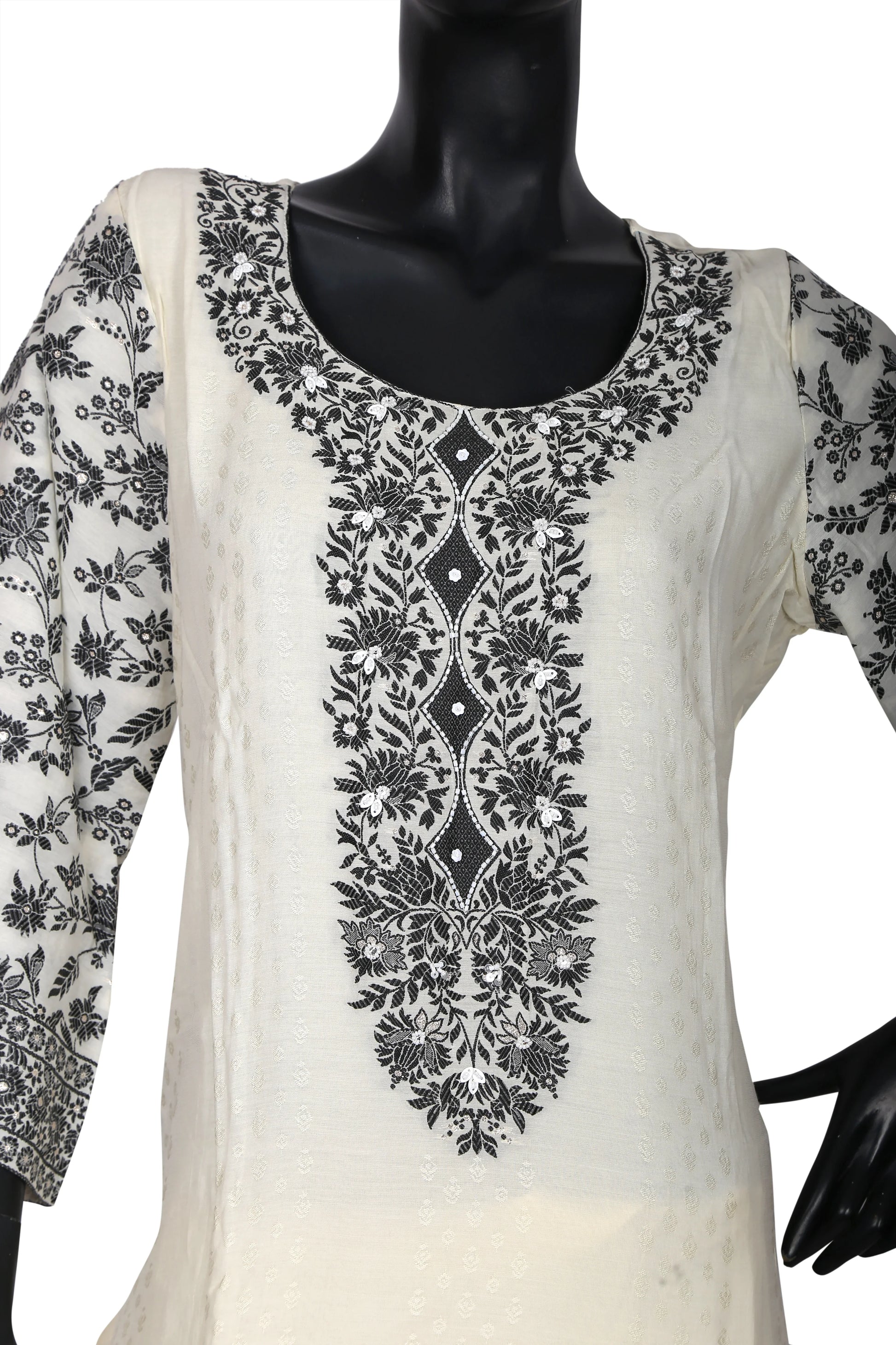 White kurta with detailed black floral embroidery on neckline and sleeves