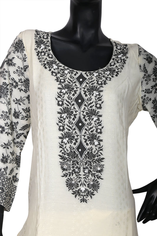 White kurta with detailed black floral embroidery on neckline and sleeves