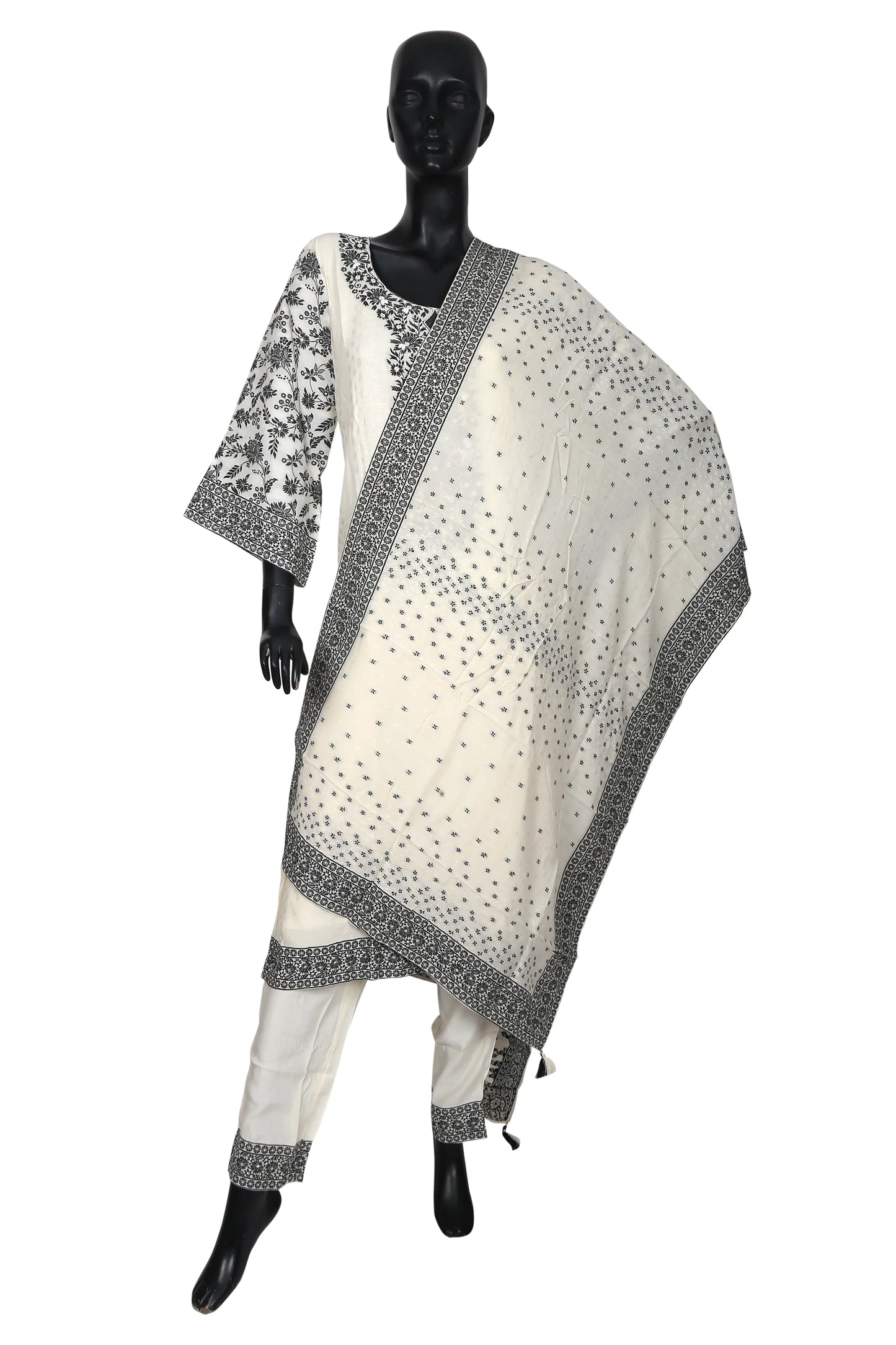 Black mannequin wearing white ethnic salwar suit with black floral embroidery and dupatta