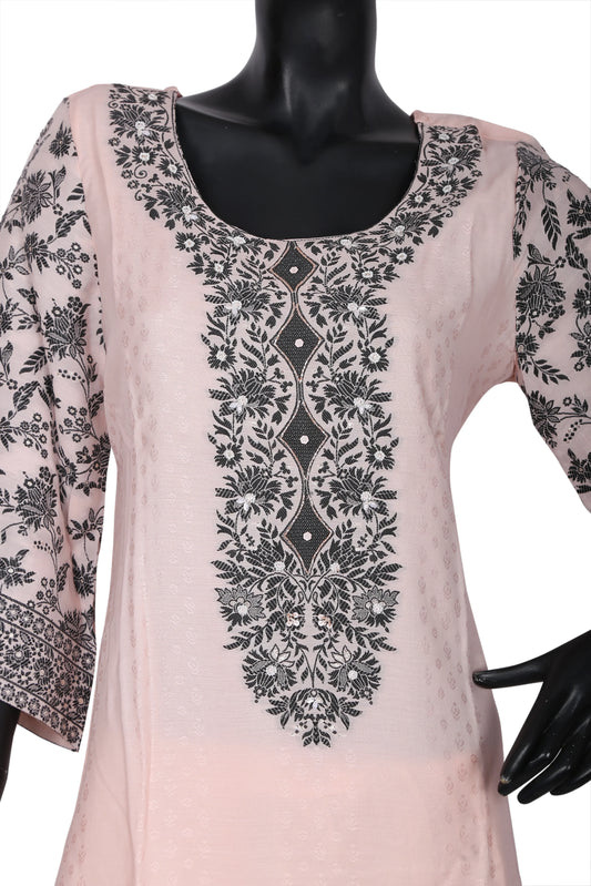 Light pink kurti with black floral embroidery on front and sleeves, displayed on mannequin