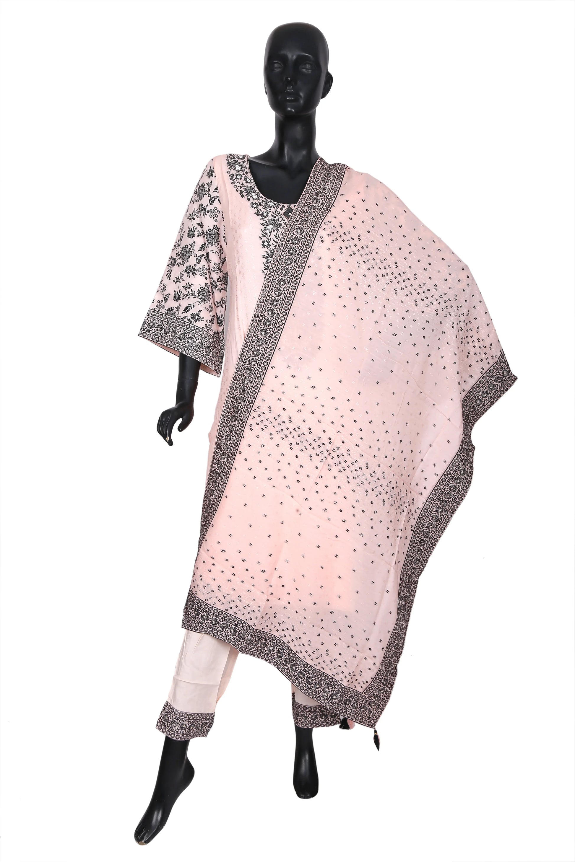 Mannequin wearing a light pink embroidered kurta set with matching dupatta and pants.