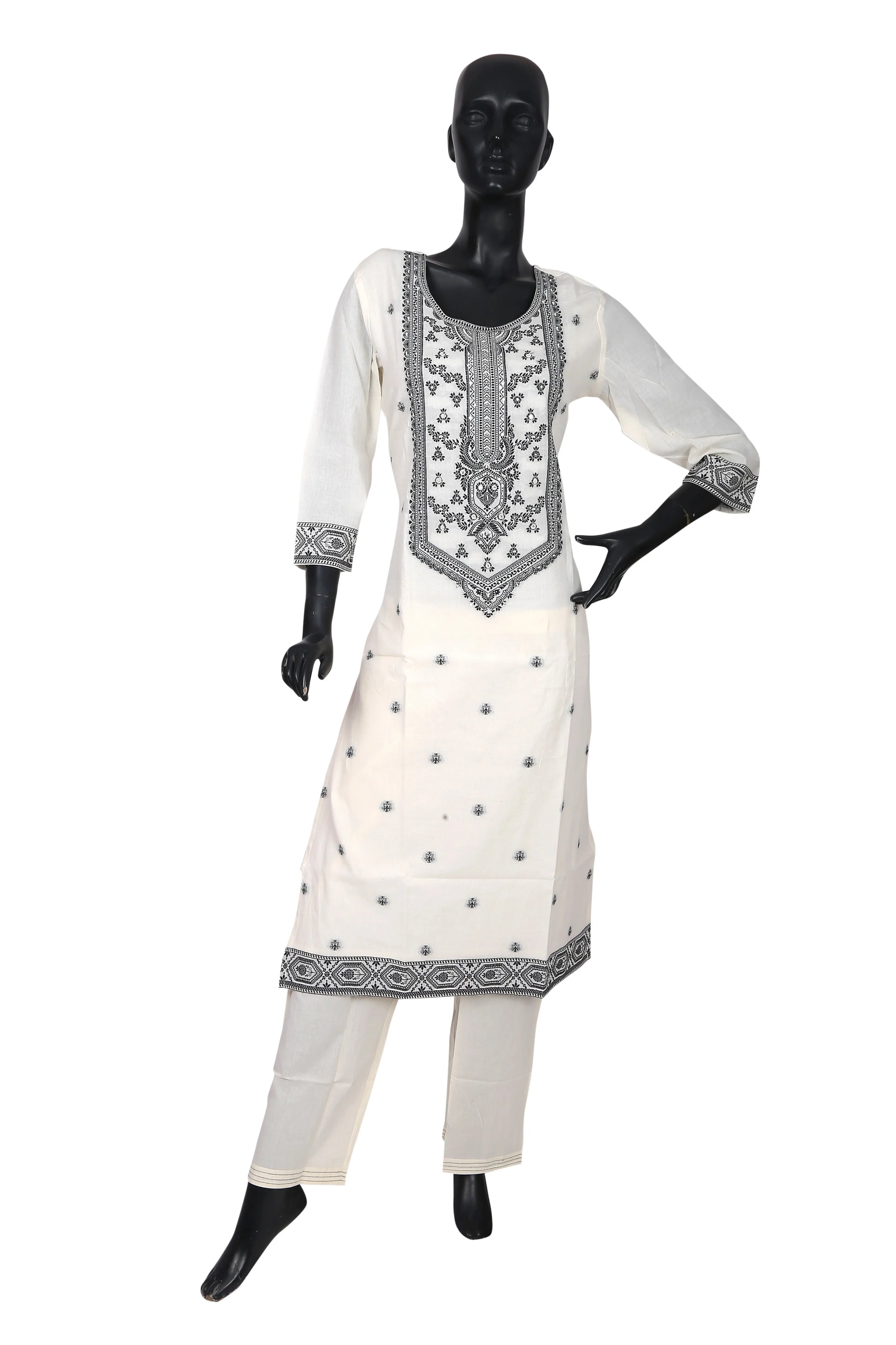 White kurta set with black embroidery displayed on mannequin, ethnic women's wear