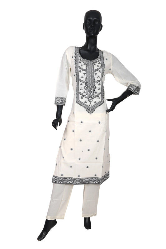 White kurta set with black embroidery displayed on mannequin, ethnic women's wear