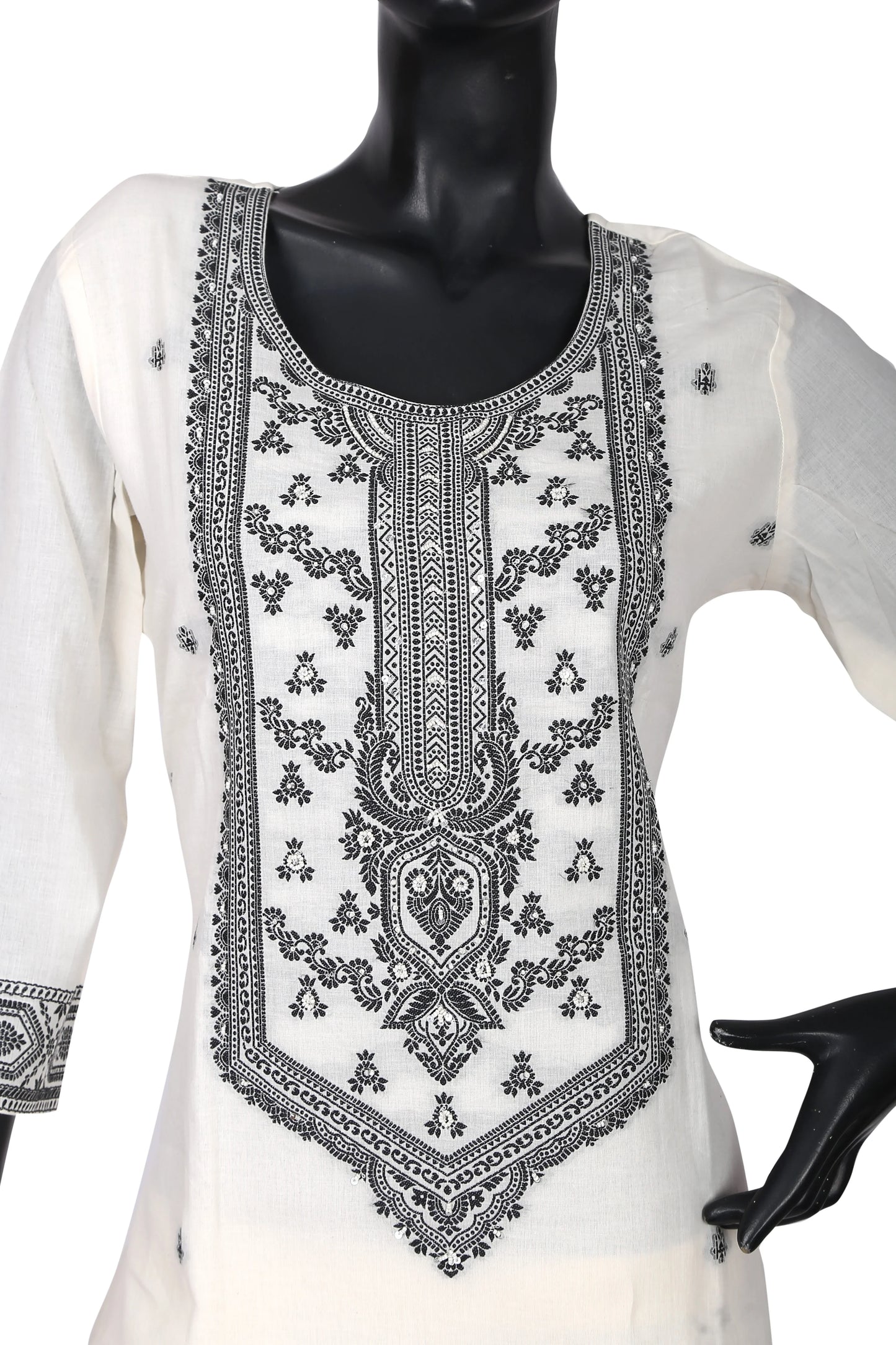 White cotton kurti with intricate black embroidery on front, displayed on mannequin