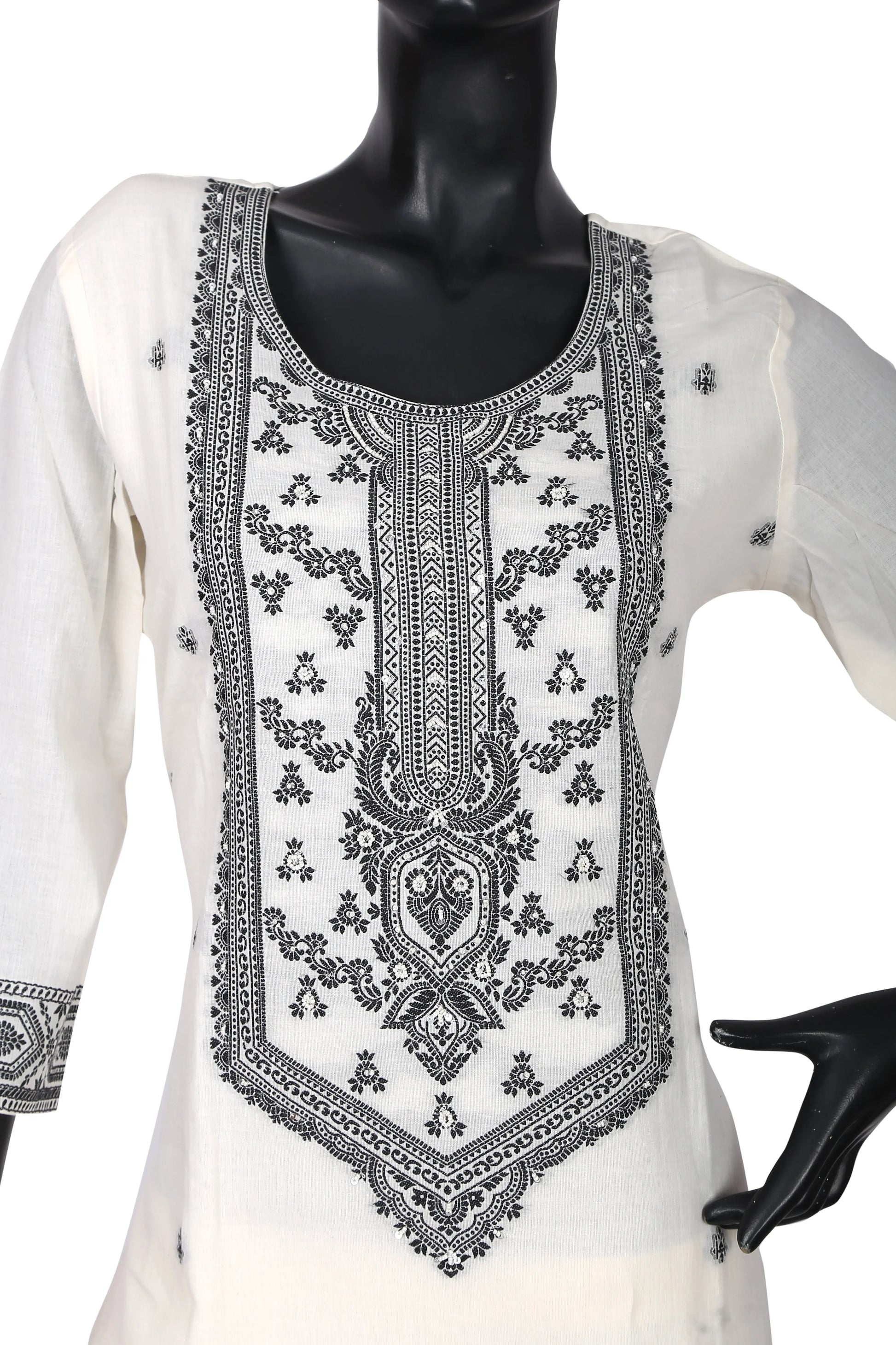 White cotton kurti with intricate black embroidery on front, displayed on mannequin