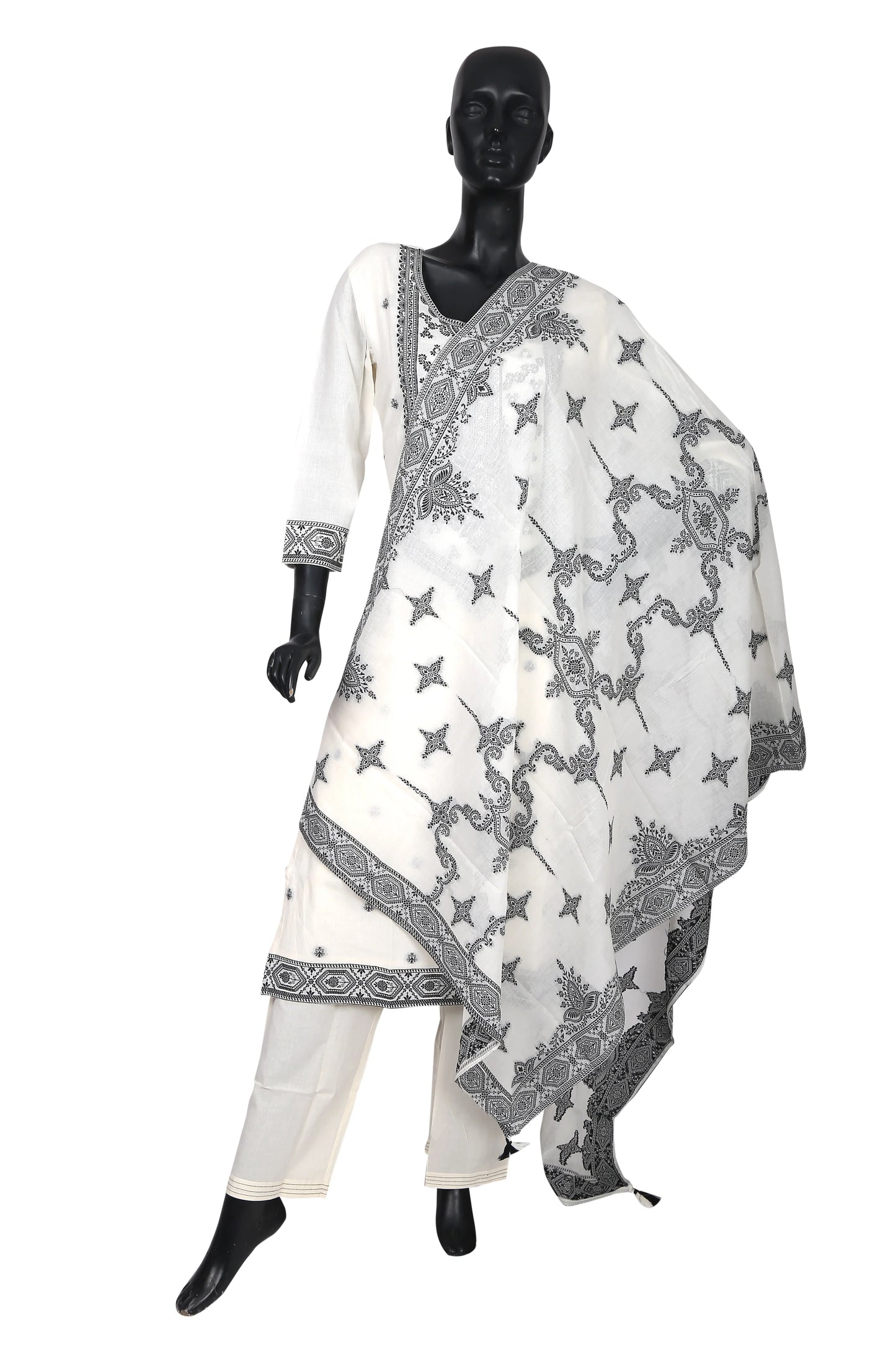 White cotton salwar suit with black traditional embroidery on mannequin