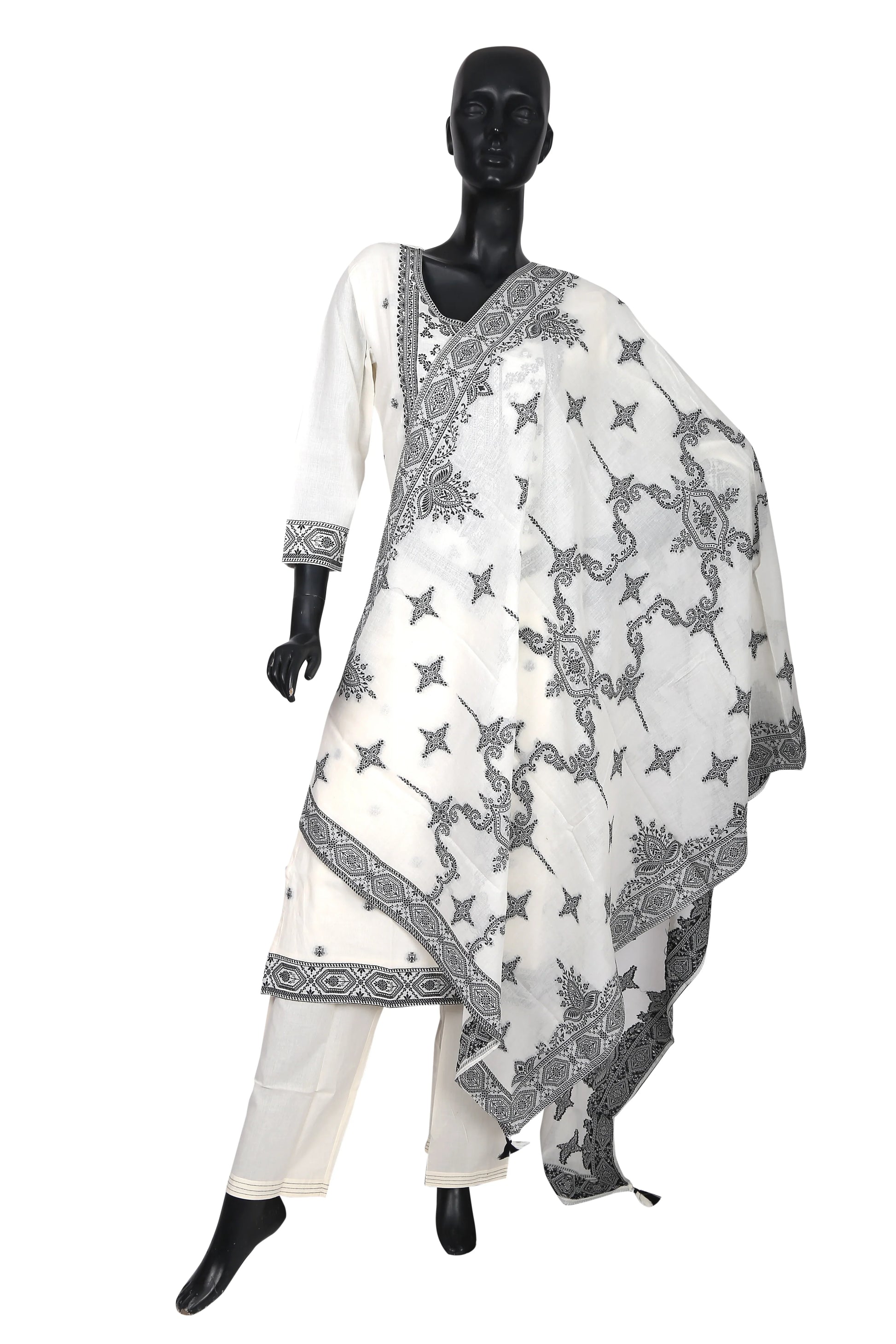 White cotton salwar suit with black traditional embroidery on mannequin