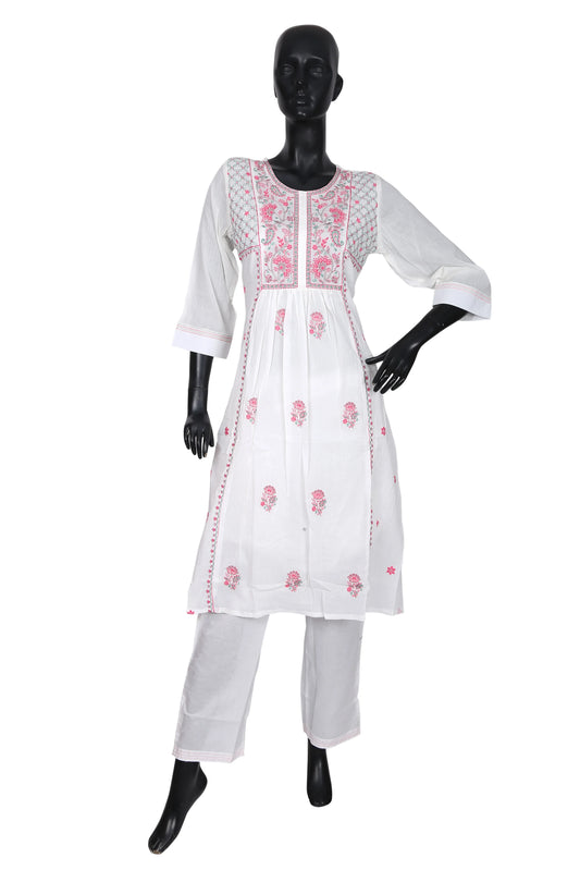 White kurta set with pink floral embroidery on mannequin, three-quarter sleeves, straight pants
