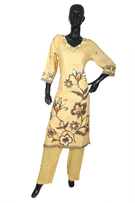 Yellow embroidered kurti and pants set on mannequin, floral ethnic design